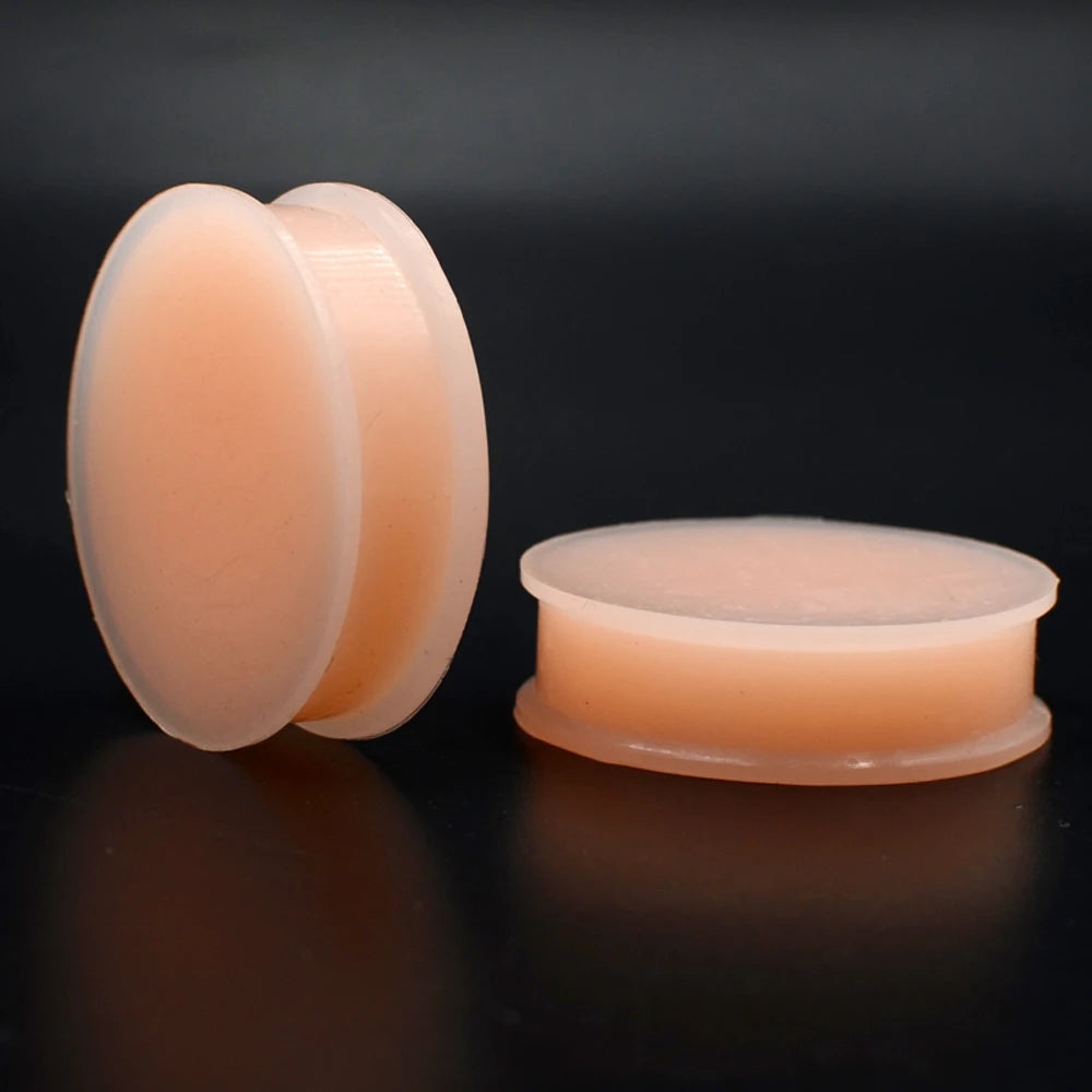 Plugs en silicone couleur chair, vue de côté