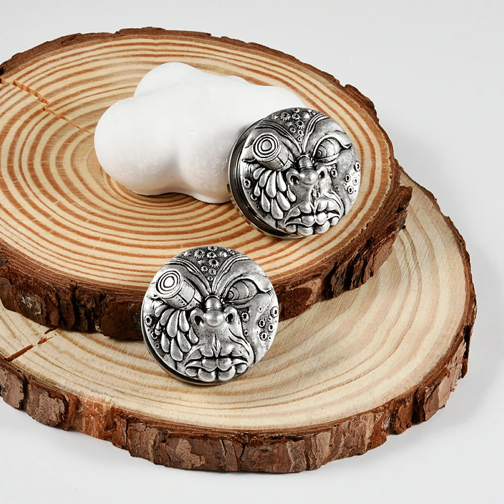 Plugs visage grimaçant en acier, paire