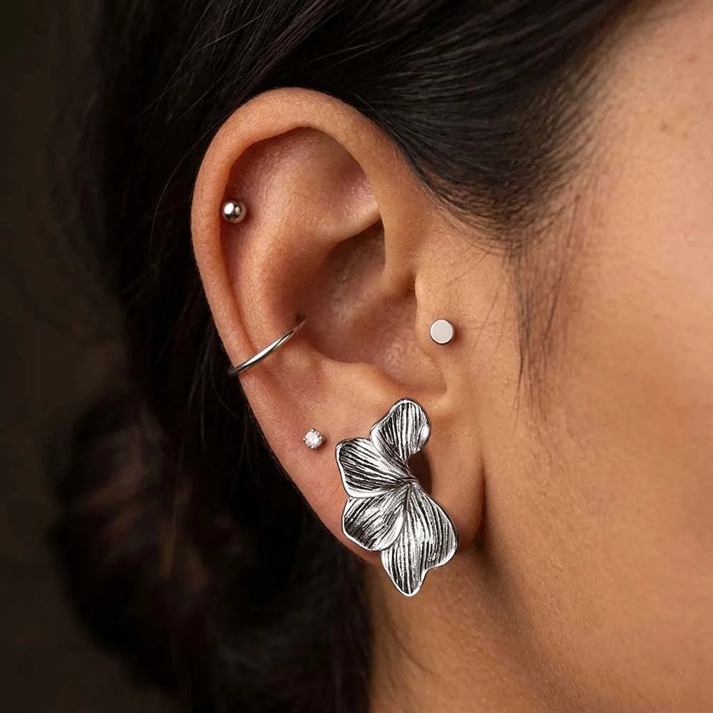 Écarteurs saddle fleur en acier inoxydable (paire)