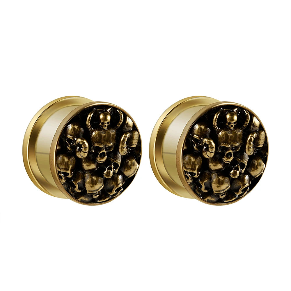 Plugs crânes dorés en acier, paire